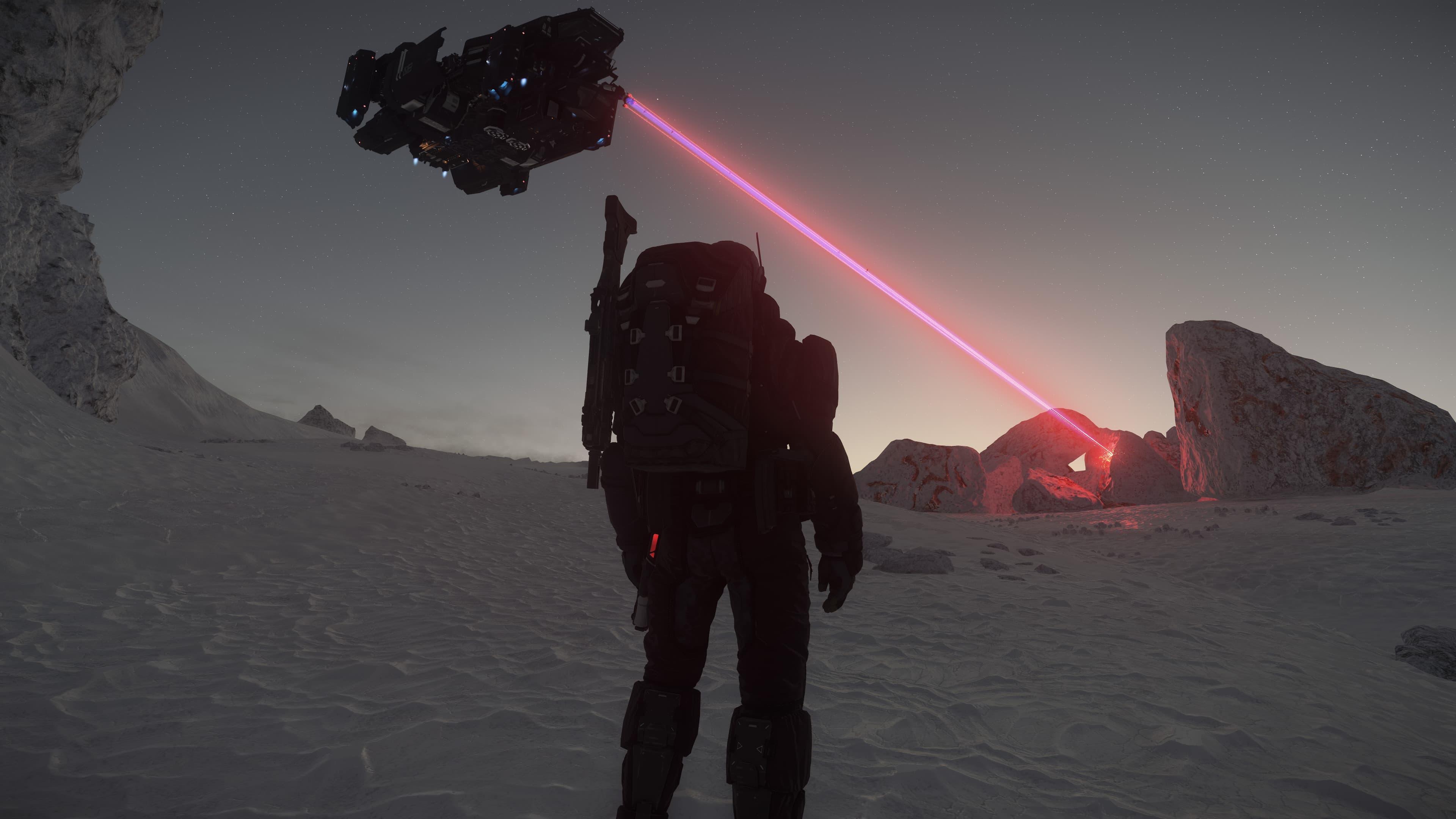 Planetary mining team with laser drilling rock